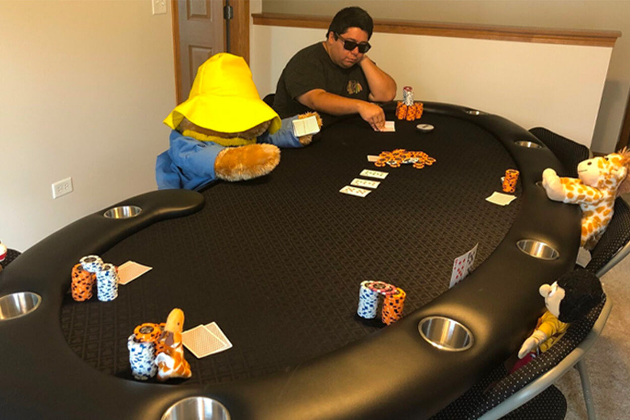 adult playing poker on the Prestige X Poker Table